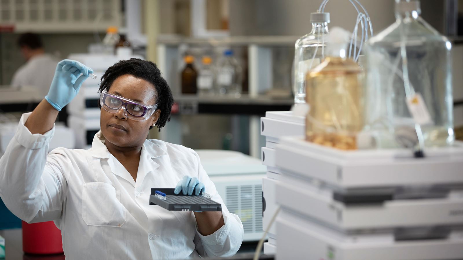 Scientist with vial